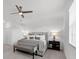 Main bedroom with plush bedding and ceiling fan at 14640 Sycamore Ct # 2822, Punta Gorda, FL 33955