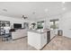Open concept kitchen with island and views into living room at 14640 Sycamore Ct # 2822, Punta Gorda, FL 33955
