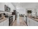 Modern kitchen with stainless steel appliances and granite countertops at 14640 Sycamore Ct # 2822, Punta Gorda, FL 33955