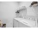 Convenient laundry room with washer, dryer, and overhead shelving at 14640 Sycamore Ct # 2822, Punta Gorda, FL 33955