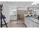 Modern bathroom with a walk-in shower, double vanity, and granite countertops at 14640 Sycamore Ct # 2822, Punta Gorda, FL 33955