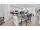 Modern kitchen with white cabinets, granite countertops, and large island at 14640 Sycamore Ct # 2822, Punta Gorda, FL 33955