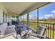 Spacious screened porch with comfortable seating and golf course views at 14640 Sycamore Ct # 2822, Punta Gorda, FL 33955