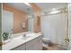 Clean bathroom with white vanity, shower, and toilet at 91 Mark Twain Ln, Rotonda West, FL 33947