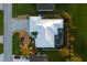 Bird's-eye view of house, pool, and surrounding landscape at 91 Mark Twain Ln, Rotonda West, FL 33947