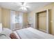 Bright bedroom with double bed, ceiling fan, and window coverings at 91 Mark Twain Ln, Rotonda West, FL 33947