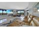 Tan leather couch and blue accent chair in front of a fireplace at 25188 Marion Ave # E301, Punta Gorda, FL 33950