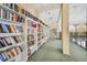 Well-lit community library with rows of bookshelves at 25188 Marion Ave # E301, Punta Gorda, FL 33950