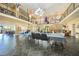 Large community room with high ceilings and tables for gatherings at 25188 Marion Ave # E301, Punta Gorda, FL 33950