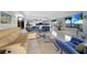 Open living room with a view into the kitchen and dining area at 25188 Marion Ave # E301, Punta Gorda, FL 33950