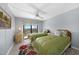 Guest bedroom with two twin beds and balcony access at 25188 Marion Ave # E301, Punta Gorda, FL 33950
