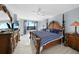 Spacious Primary bedroom with large bed and water views at 25188 Marion Ave # E301, Punta Gorda, FL 33950