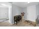 Bright condo entryway with a decorative console table and starfish rugs at 25188 Marion Ave # E301, Punta Gorda, FL 33950