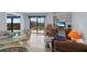 Comfortable living space with seating, desk and balcony access at 25188 Marion Ave # E301, Punta Gorda, FL 33950
