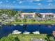 Aerial view of waterfront community with boat docks and lush landscaping at 25188 Marion Ave # E301, Punta Gorda, FL 33950