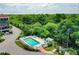 Small, community pool with surrounding lounge chairs at 25188 Marion Ave # E301, Punta Gorda, FL 33950