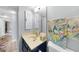 Simple bathroom with single sink, toilet and mirror at 25188 Marion Ave # E301, Punta Gorda, FL 33950