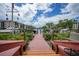 Wooden community dock extending to the water with boat slips at 25188 Marion Ave # E301, Punta Gorda, FL 33950