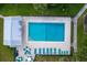 Inviting community pool with lounge chairs and patio tables at 25188 Marion Ave # E301, Punta Gorda, FL 33950