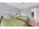 Guest bedroom with two twin beds and closet at 25188 Marion Ave # E301, Punta Gorda, FL 33950