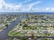 Wide aerial showcasing the neighborhood, waterways, and the property's location at 132 Concord Ne Dr, Port Charlotte, FL 33952