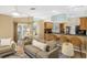 Comfortable living room adjacent to kitchen and dining area at 91 Mark Twain Ln, Rotonda West, FL 33947
