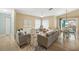 Open concept living room with neutral tones and natural light at 91 Mark Twain Ln, Rotonda West, FL 33947