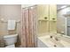 Clean bathroom with shower/tub combo, vanity, and linen storage at 91 Mark Twain Ln, Rotonda West, FL 33947