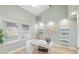 Bright and airy home office with light wood floors and large window at 91 Mark Twain Ln, Rotonda West, FL 33947