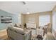 Spacious living room with ample natural light and neutral decor at 91 Mark Twain Ln, Rotonda West, FL 33947