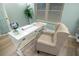 Bright home office features built-in shelving and a comfortable seating area at 91 Mark Twain Ln, Rotonda West, FL 33947