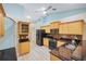 Open concept kitchen featuring granite countertops and stainless steel appliances at 91 Mark Twain Ln, Rotonda West, FL 33947