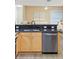 Kitchen with stainless steel dishwasher and double sink at 91 Mark Twain Ln, Rotonda West, FL 33947