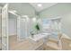 Home office with built-in shelving and access to another room at 91 Mark Twain Ln, Rotonda West, FL 33947