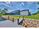 Back exterior view of home showcasing a private dock and screened enclosure at 1419 Liggett Cir, Port Charlotte, FL 33953