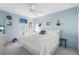 Spacious bedroom with king-size bed and light blue walls at 25188 Marion Ave # B304, Punta Gorda, FL 33950