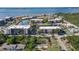 Aerial view of waterfront community with tennis courts at 25188 Marion Ave # B304, Punta Gorda, FL 33950
