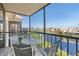 Spacious balcony overlooking the water with outdoor seating at 25188 Marion Ave # B304, Punta Gorda, FL 33950