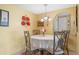 Cozy dining area with a round table and four chairs at 25188 Marion Ave # B304, Punta Gorda, FL 33950