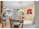 Round dining table with chairs in a bright dining area at 25188 Marion Ave # B304, Punta Gorda, FL 33950