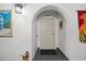 Private condo entry with a door and decorative wall art at 25188 Marion Ave # B304, Punta Gorda, FL 33950