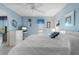 King-size bedroom with white dresser and ceiling fan at 25188 Marion Ave # B304, Punta Gorda, FL 33950