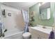 Bathroom with tub, vanity, and shower at 25188 Marion Ave # B304, Punta Gorda, FL 33950