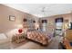 Comfortable bedroom with double bed and wicker furniture at 25188 Marion Ave # B304, Punta Gorda, FL 33950