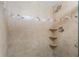 Walk-in shower with tile surround and built-in shelves at 25188 Marion Ave # B304, Punta Gorda, FL 33950