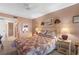 Spacious bedroom with double bed and ceiling fan at 25188 Marion Ave # B304, Punta Gorda, FL 33950