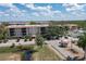 Condo building with parking and gated entrance at 25188 Marion Ave # B304, Punta Gorda, FL 33950