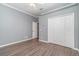 Bright bedroom with double doors and wood-look floors at 1858 Norvell Ave, North Port, FL 34286