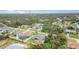Aerial view showcasing neighborhood homes and landscape at 1858 Norvell Ave, North Port, FL 34286