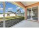 Screened patio overlooking backyard at 1858 Norvell Ave, North Port, FL 34286